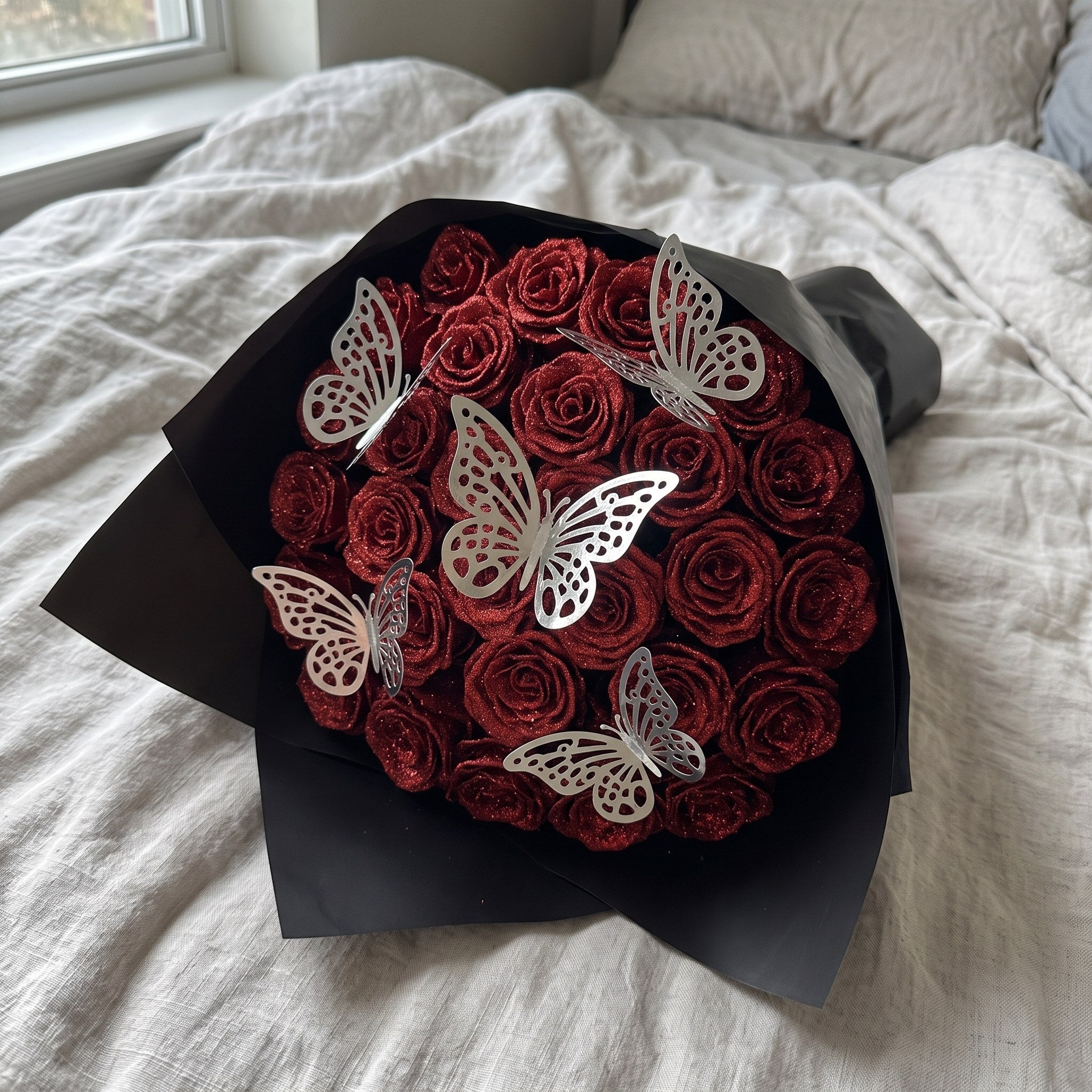 Butterflies in a glitter rose bouquet