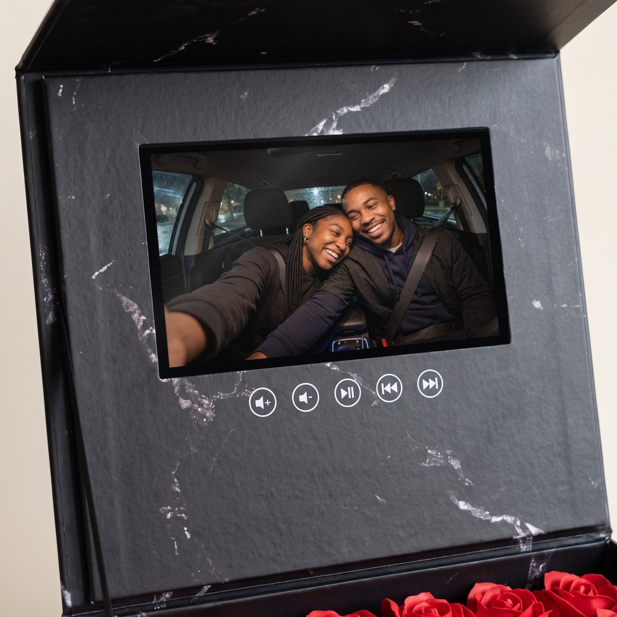 The 7-inch screen playing a couple's car selfie